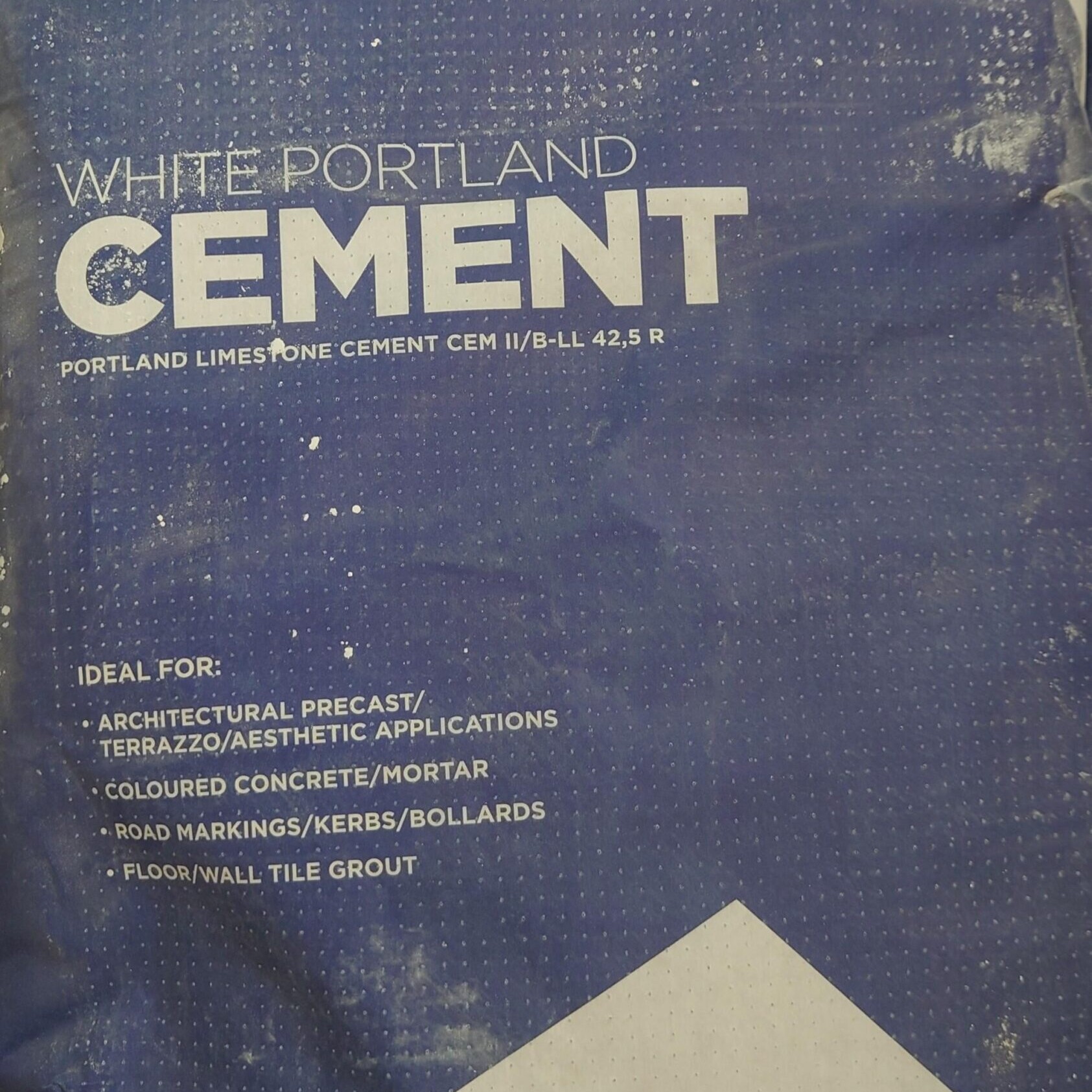 The 25kg Bag Premium White Cement is ideal for architectural projects, terrazzo, coloured concrete, road markings, and tile grout. The blue bag has bold white lettering and highlights its versatile uses.
