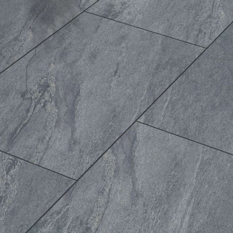 Premier Cathedral Anthracite Porcelain 900x600x20mm tiles feature a natural textured slate look, subtle color variations, and veining. These rectangular tiles are 20mm thick and are often laid in an offset pattern for added visual interest.