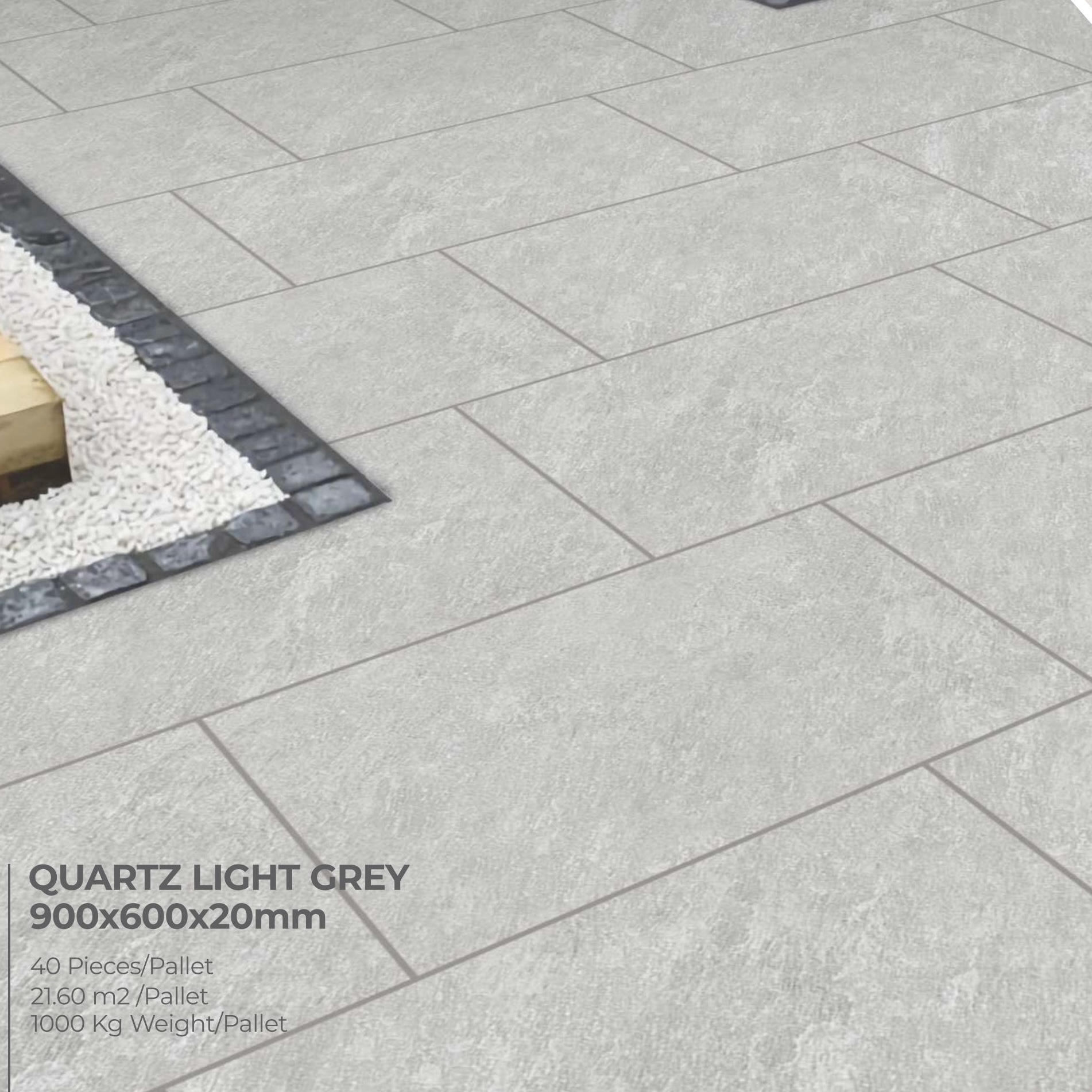 Premier Avantgarde Quartz Light Grey 21.6m² Porcelain tiles, designed to mimic Raj natural paving, are arranged in a staggered floor pattern beside white stones bordered by black tiles.
