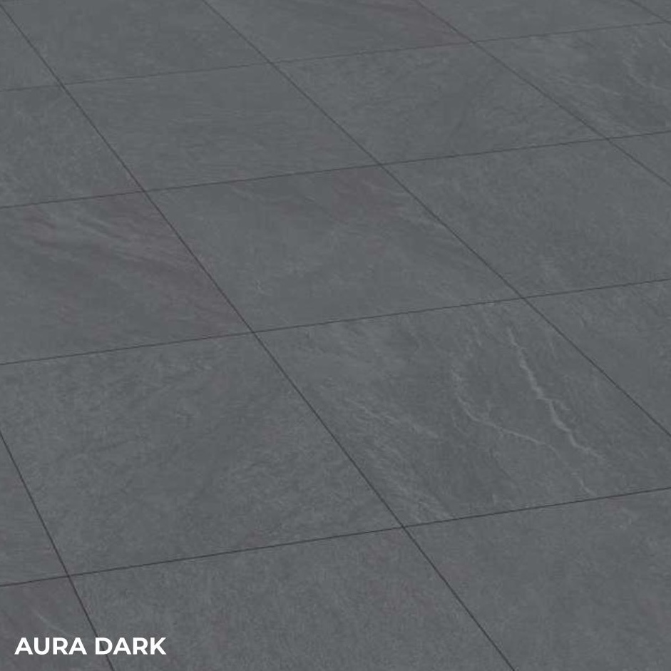 Aura Dark Porcelain 600x600x20mm Pack features dark gray stone-look tiles in a grid, with subtle veining and texture for an elegant finish. 