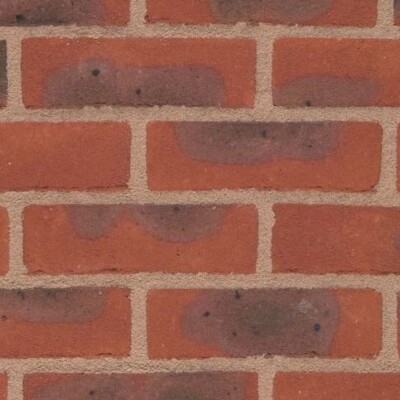 Close-up of a Lingfield Multi Red 65mm brick wall with beige mortar. Some bricks feature darker patches, adding varied texture. The bricks are arranged in a staggered horizontal pattern.